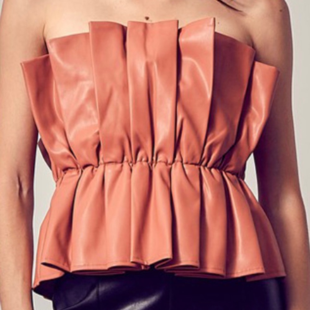 “Petal” Strapless polyurethane peplum in dusty rose.